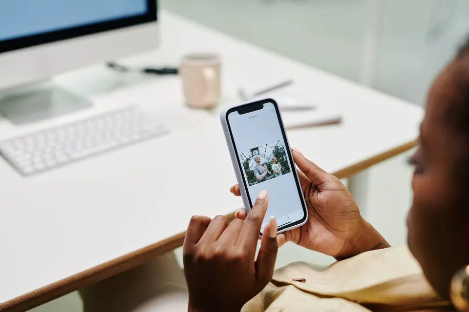 Person using a smartphone at a desk