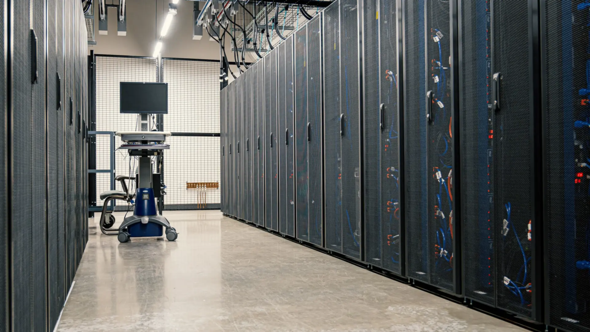 Rows of server racks inside a secure data centre