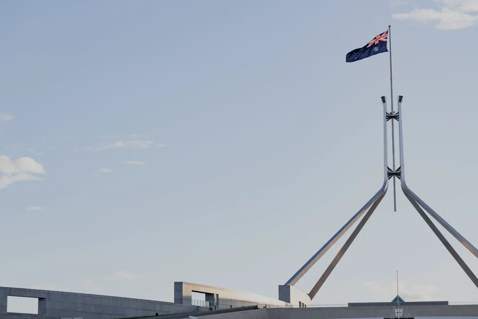 Parliament House in Canberra under a clear blue sky