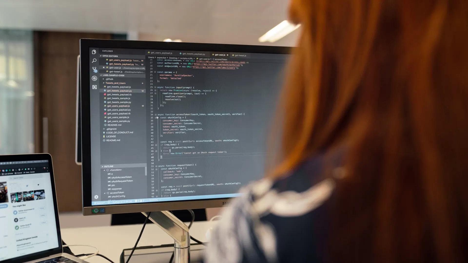 Software engineer writing code at her workstation